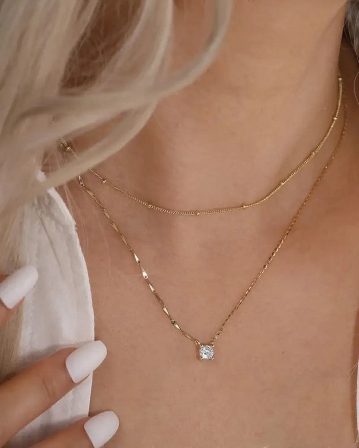 Pearlystones gold plated sterling silver necklace with a cubic zirconia pendant and dapped bar cable chain