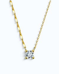 Pearlystones gold-plated sterling silver necklace featuring a brilliant-cut cubic zirconia pendant on a dapped chain.