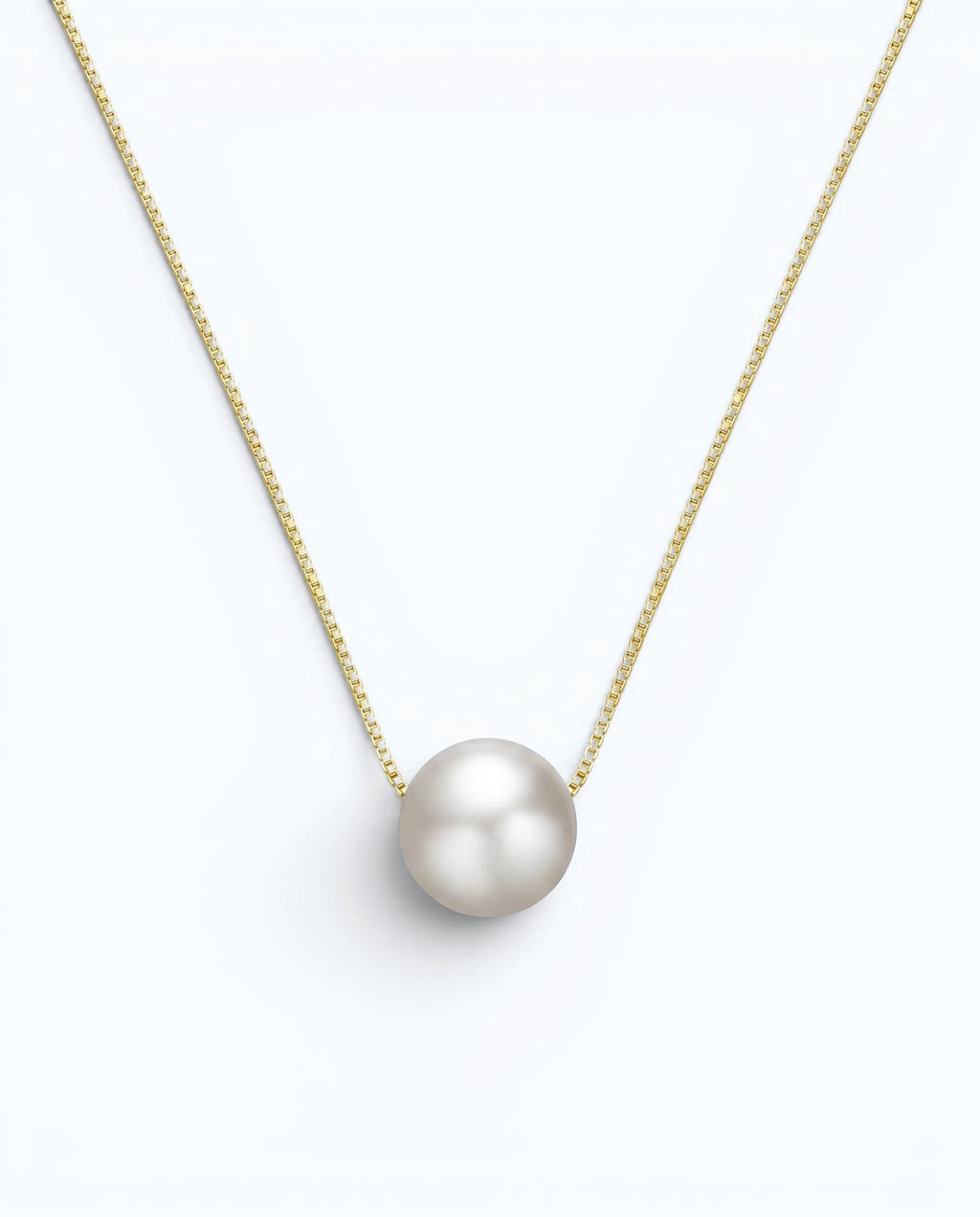 Pearlystones minimalist floating freshwater pearl necklace on a delicate gold-tone sterling silver box chain.