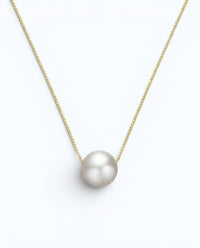 Pearlystones minimalist floating freshwater pearl necklace on a delicate gold-tone sterling silver box chain.
