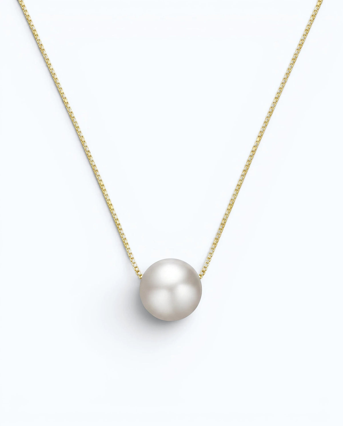 Pearlystones minimalist floating freshwater pearl necklace on a delicate gold-tone sterling silver box chain.