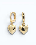 Pearlystones gold heart charm hoop earrings crafted from sterling silver with a puffed heart pendant.