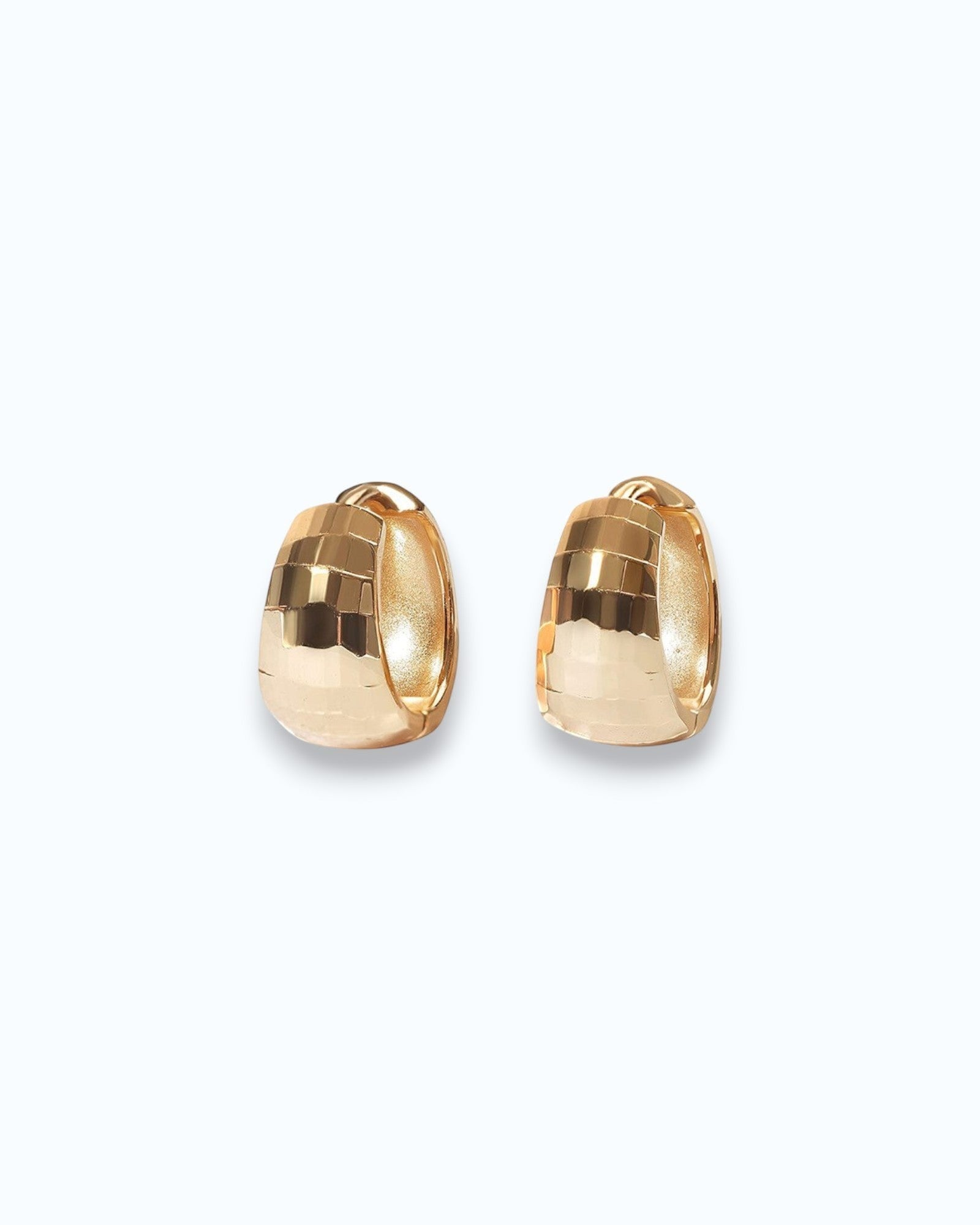 Pearlstones gold-tone sterling silver huggie hoop earrings with geometric texture.
