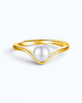 Pearlystones minimalist V-shaped gold ring featuring a single lustrous natural freshwater pearl on a smooth band.