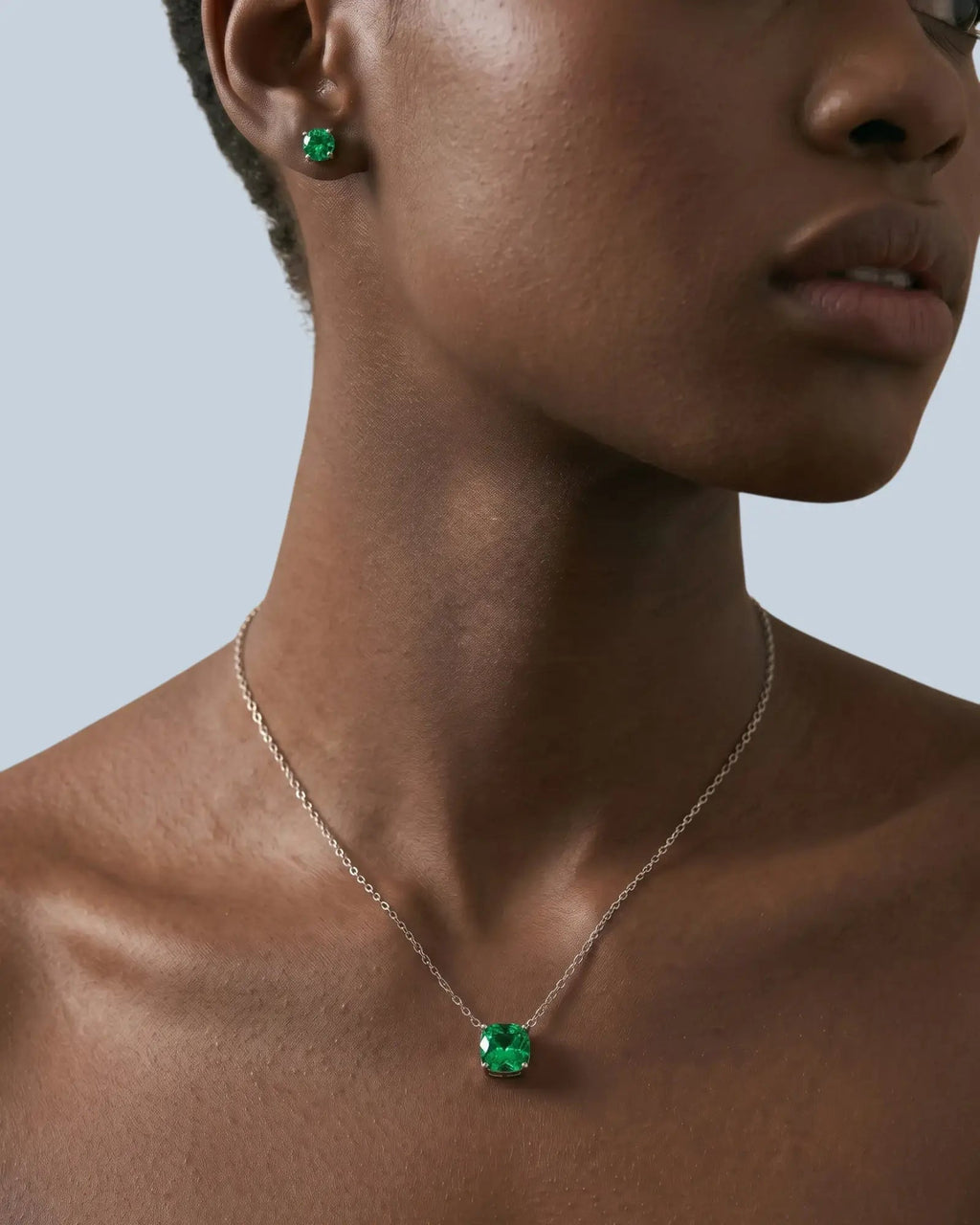 Pearlystones octagonal rose cut green cubic zirconia pendant necklace in rhodium-plated sterling silver on a model.