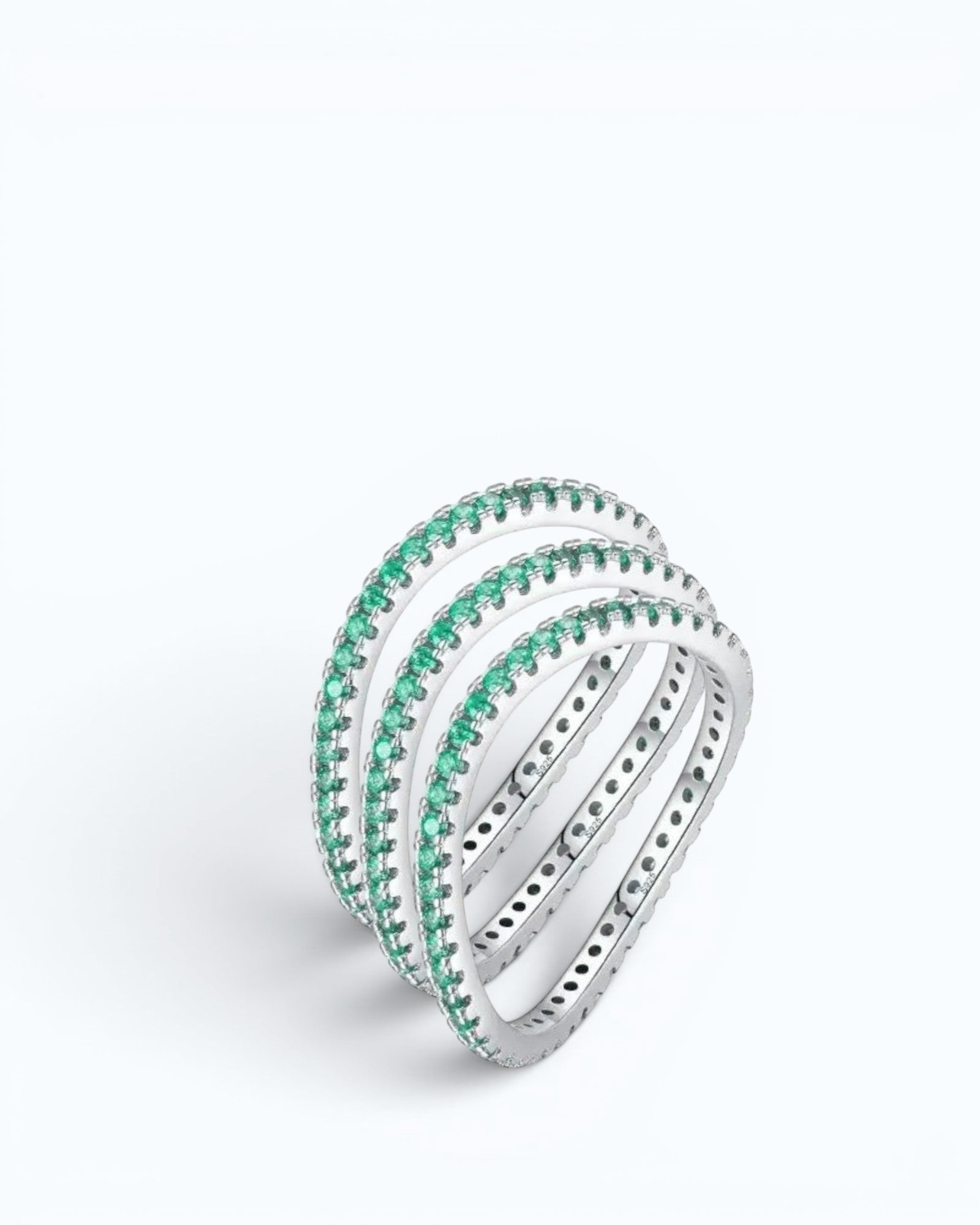 Pearlystones delicate eternity band ring featuring vibrant emerald-green stones set in a polished silver band.