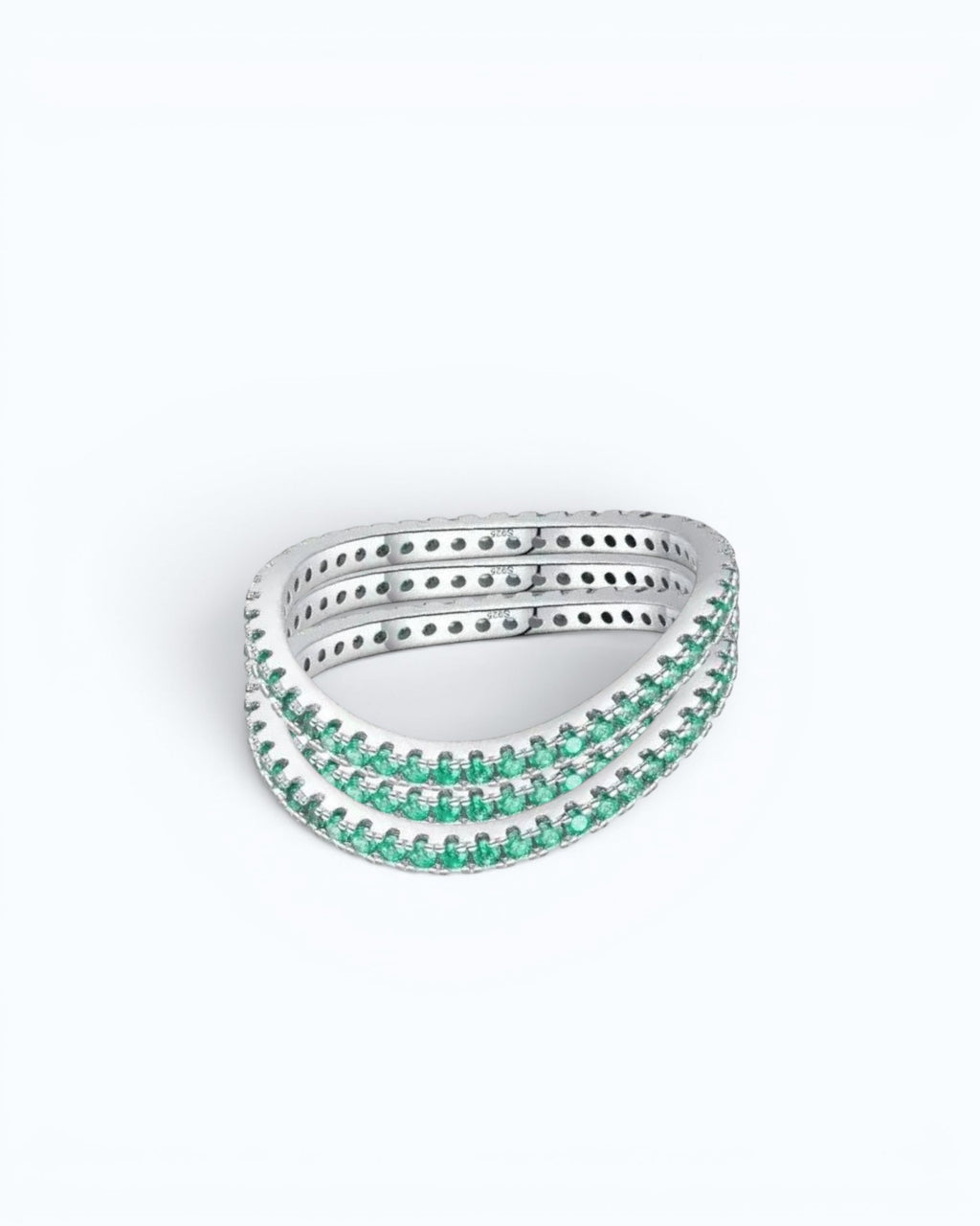 Pearlystones delicate eternity band ring featuring vibrant emerald-green stones set in a polished silver band.