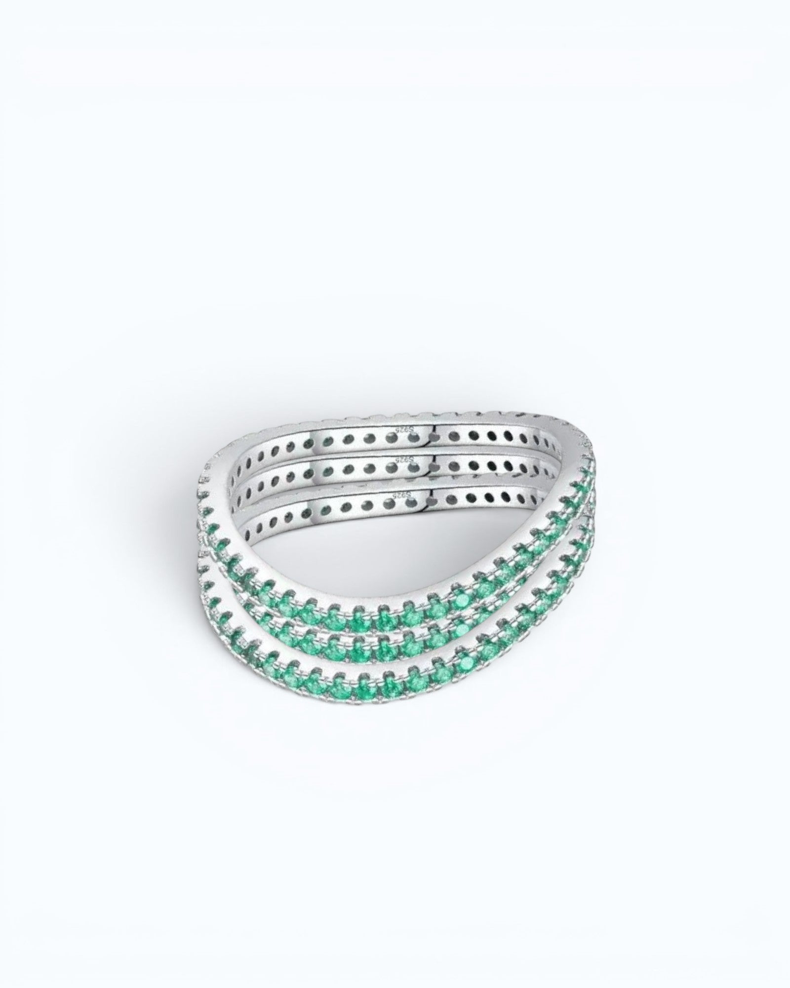 Pearlystones delicate eternity band ring featuring vibrant emerald-green stones set in a polished silver band.