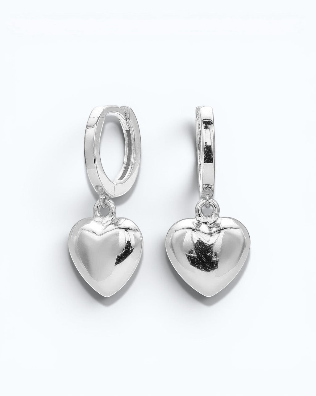 Pearlystones silver sterling heart charm hoop earrings. Classic hoop with a puffed heart charm.