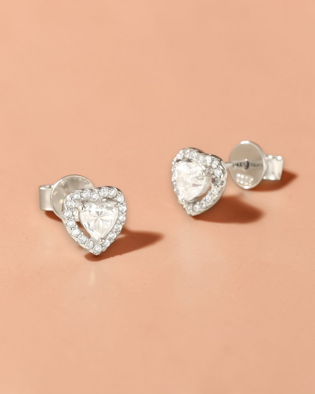 0.6 Ct Hollow Stud Heart moissanite earrings with sparkling stones and silver settings
