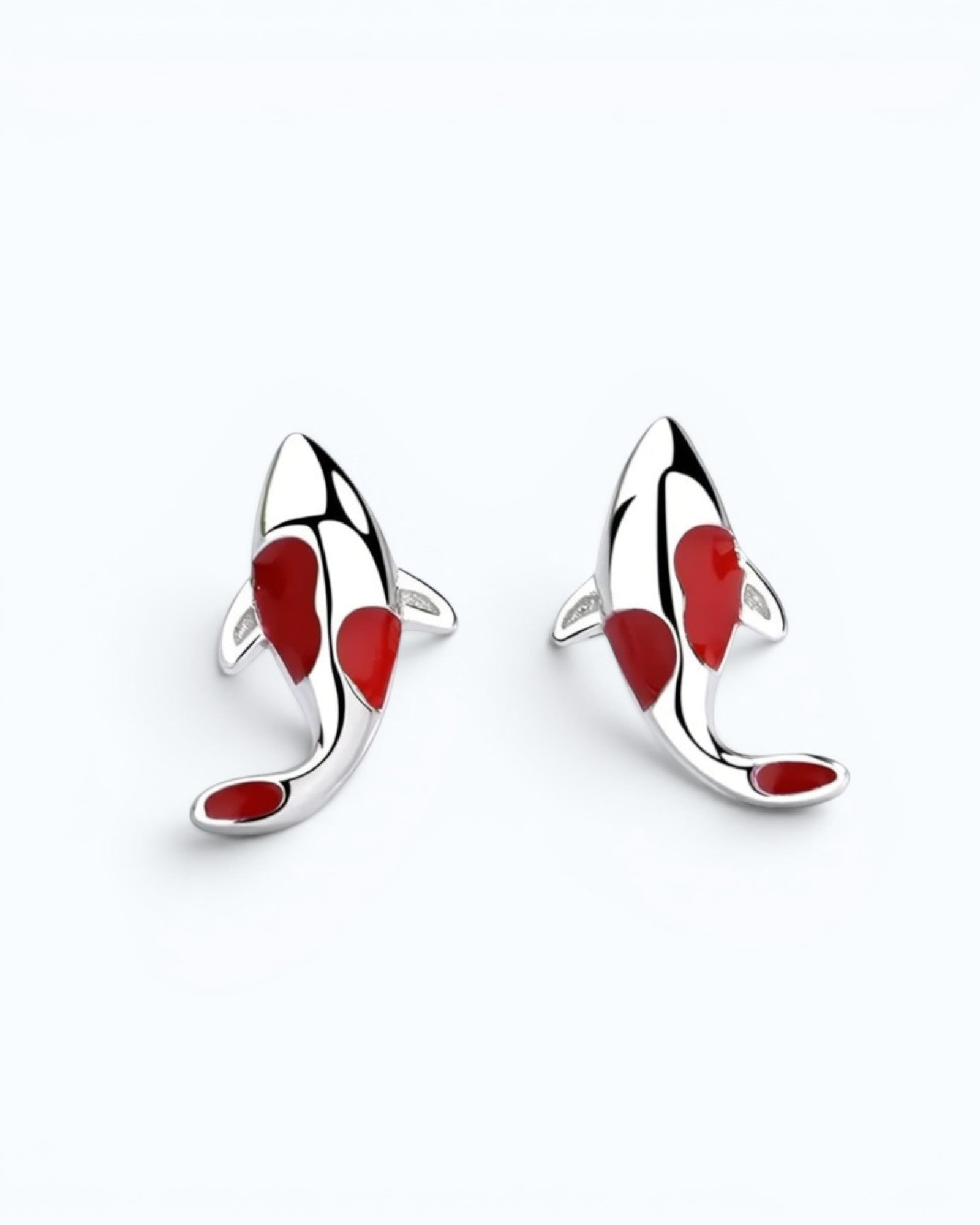 Pearlystones koi fish stud earrings in silver with vibrant red enamel detailing on a clean white background