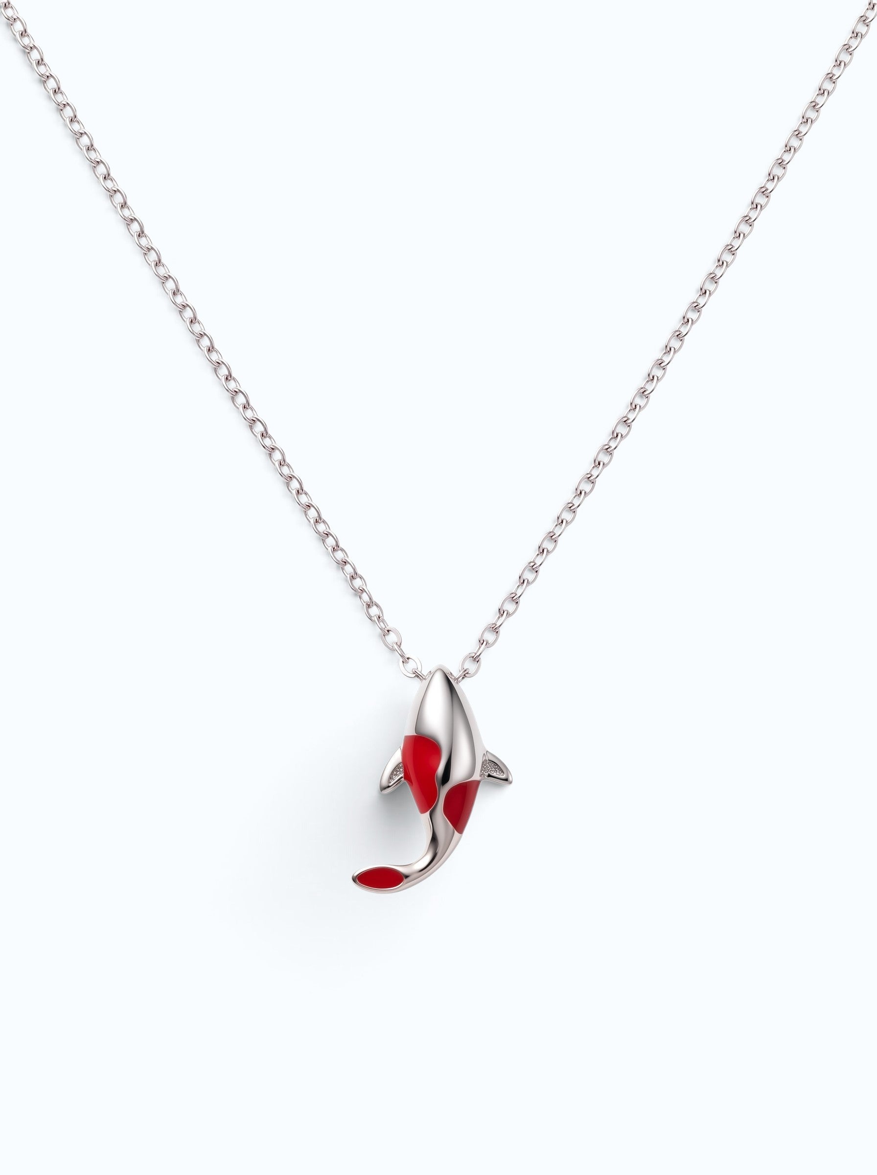 Pearlystones koi fish pendant necklace in silver with vibrant red enamel detailing on a delicate chain