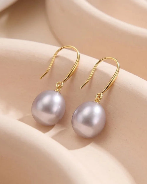 Pearlystones Classic Purple Pearl Drop Earrings with gold-tone hooks. Lustrous pearls in a delicate purple hue.