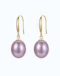 pearlystones Classic Purple Pearl Drop Earrings with gold-tone hooks. Lustrous pearls in a delicate purple hue.