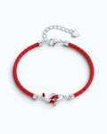 Pearlystones red cord bracelet featuring a silver koi fish charm with vibrant red enamel detailing and adjustable chain
