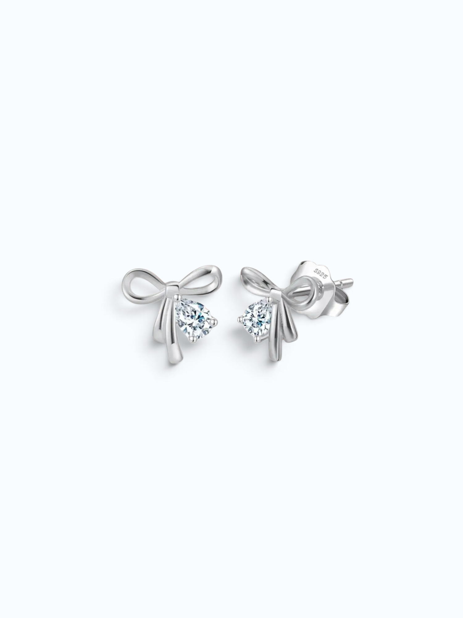 Pearlystones rhodium-finish bowknot stud earrings with a sparkling pear-shaped crystal center on a white background.