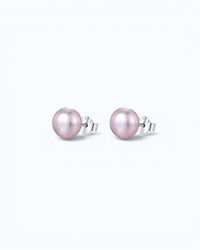 Pearlystones classic round purple pearl stud earrings with silver posts on a clean white background.