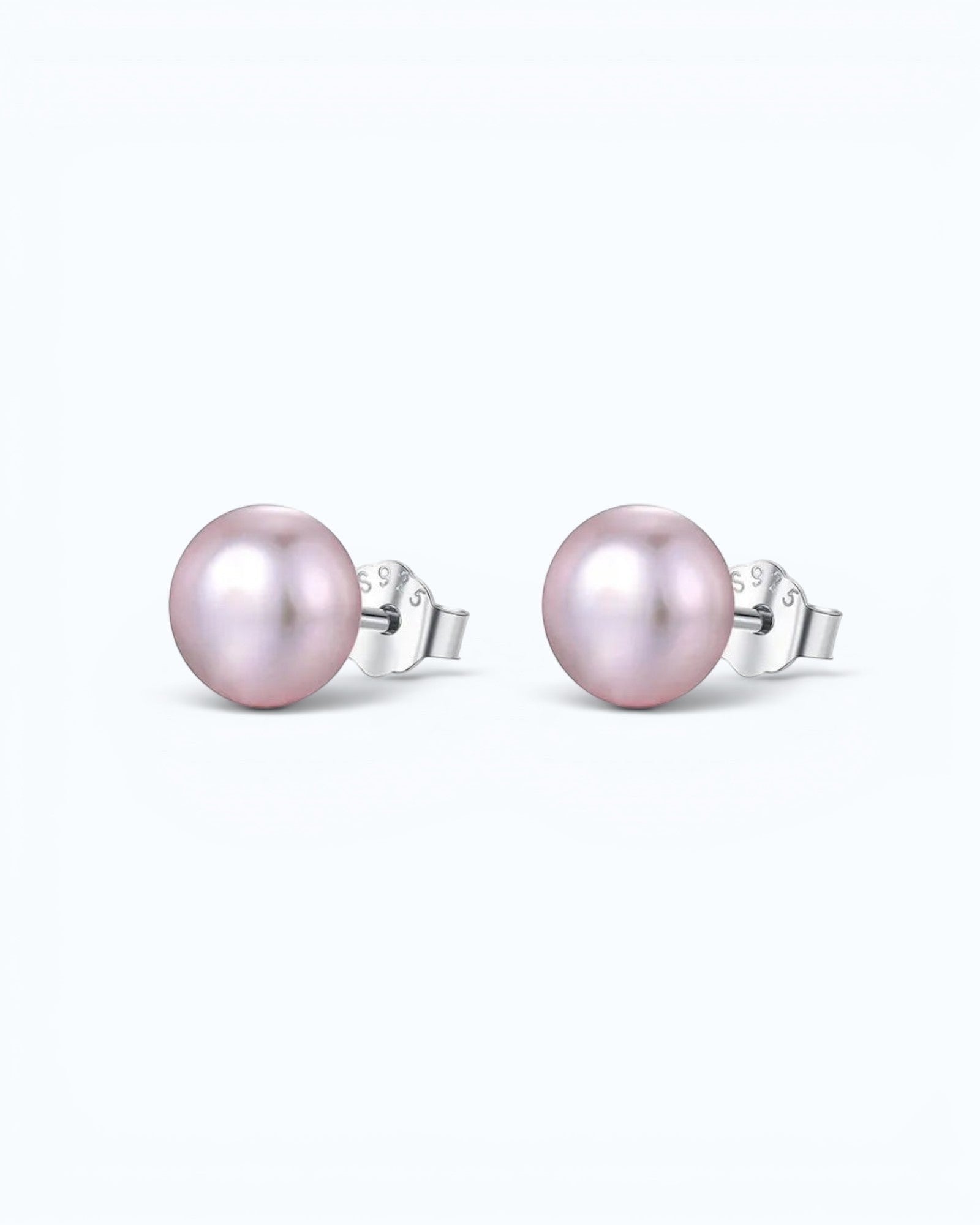 Pearlystones classic round purple pearl stud earrings with silver posts on a clean white background.