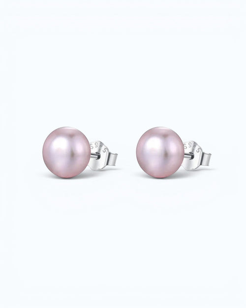 Pearlystones classic round purple pearl stud earrings with silver posts on a clean white background.