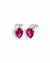 Pearlystones ruby red cubic zirconia water droplet stud earrings in a minimalist silver setting.