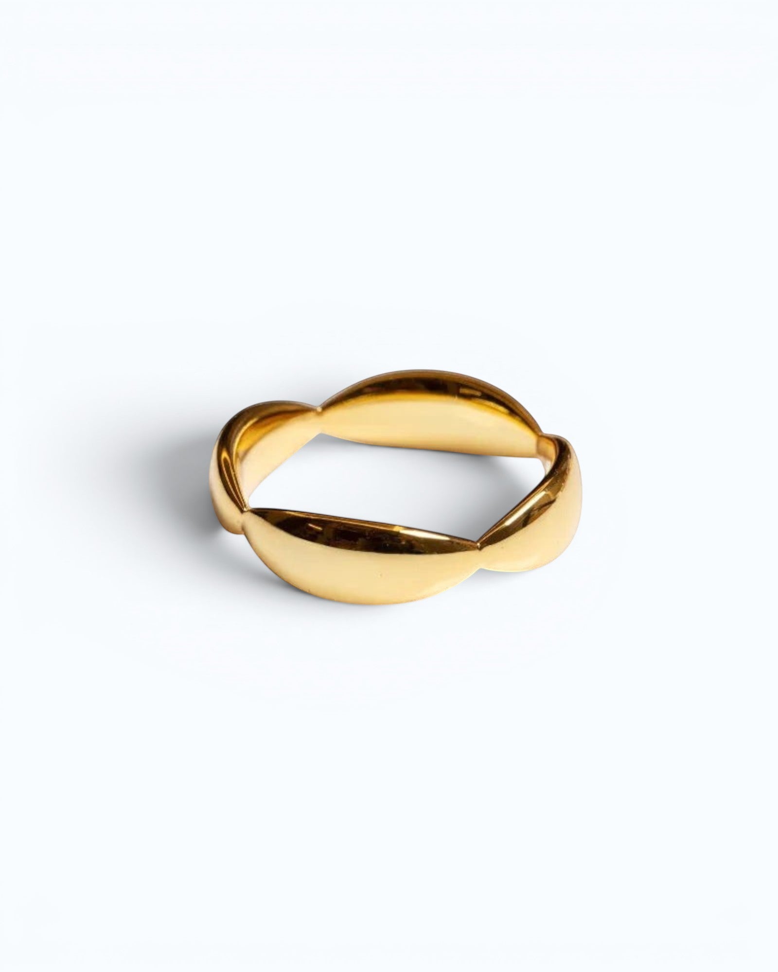Pearlystones Sculptural Wave Band Ring in polished gold metal with a lustrous finish.
