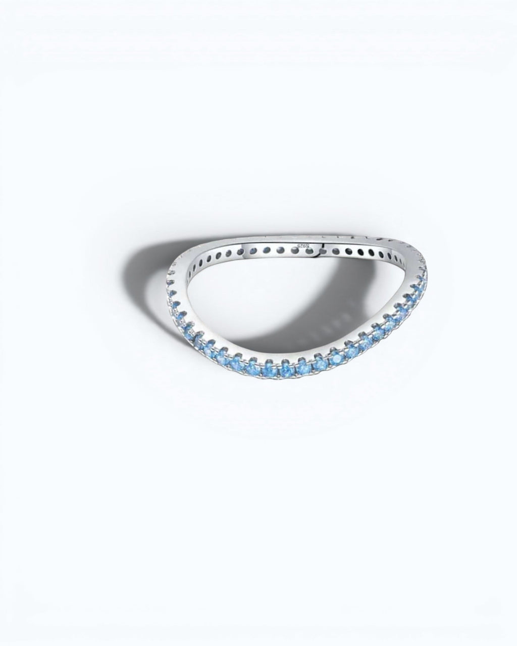 Pearlystones Azure Glow eternity band in sterling silver featuring a row of vibrant blue zircon stones.
