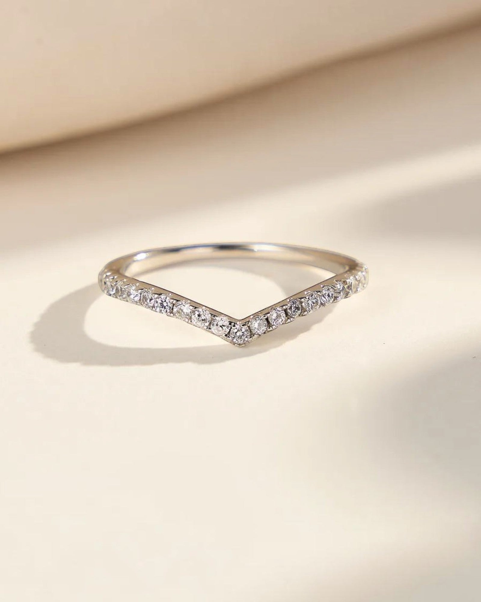 Pearlystones silver chevron ring with pavé-set zircon stones on a V-shaped sterling silver band.