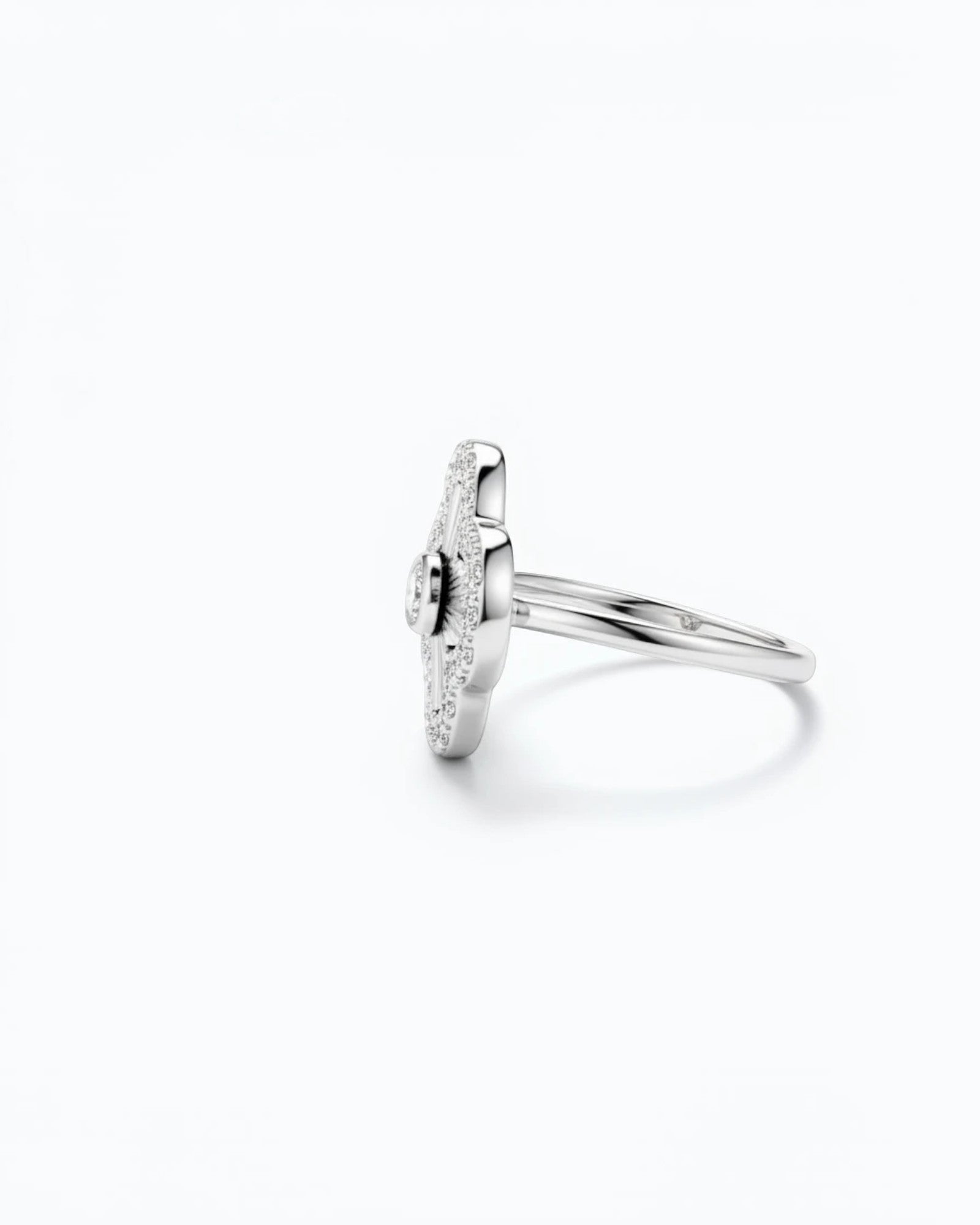 Pearlystones sterling silver clover ring with laser-engraved sunburst petals and pavé zircon halo, side profile view