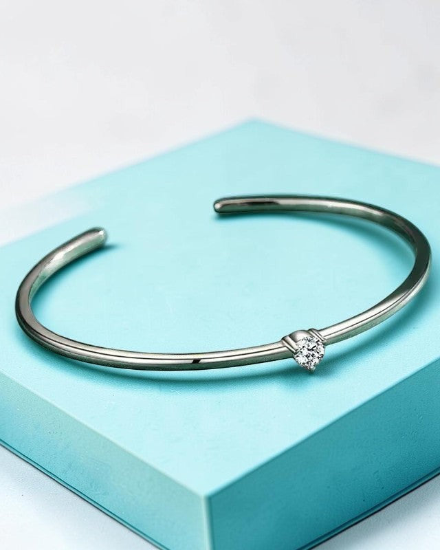 Pearlystones silver cuff bracelet with a single clear Zircon accent. Minimalist, sleek design for everyday wear.