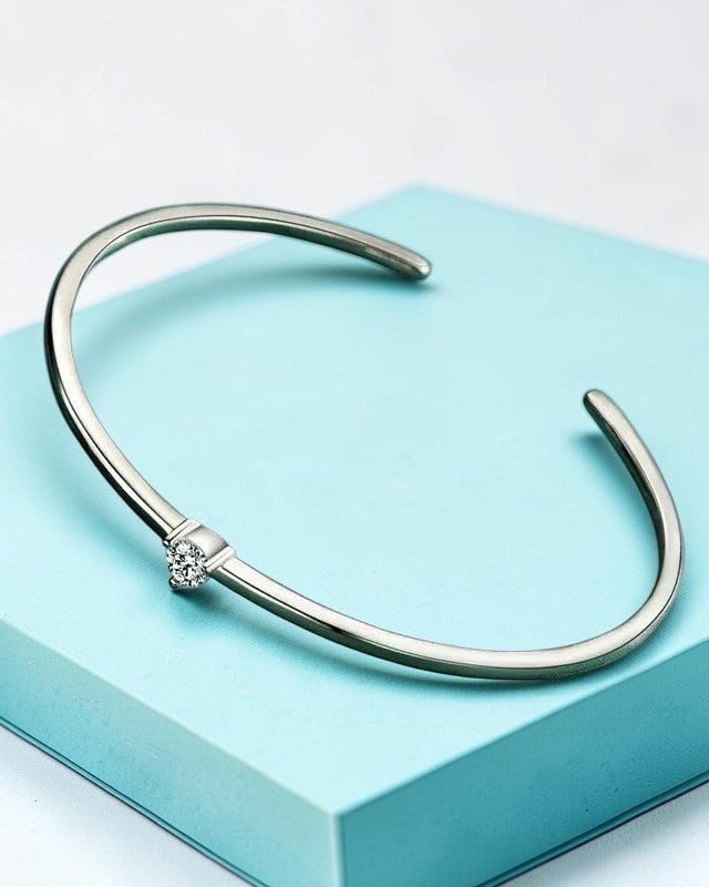 Pearlystones silver-tone cuff bracelet with a single clear Zircon accent. Minimalist design, perfect for everyday wear.
