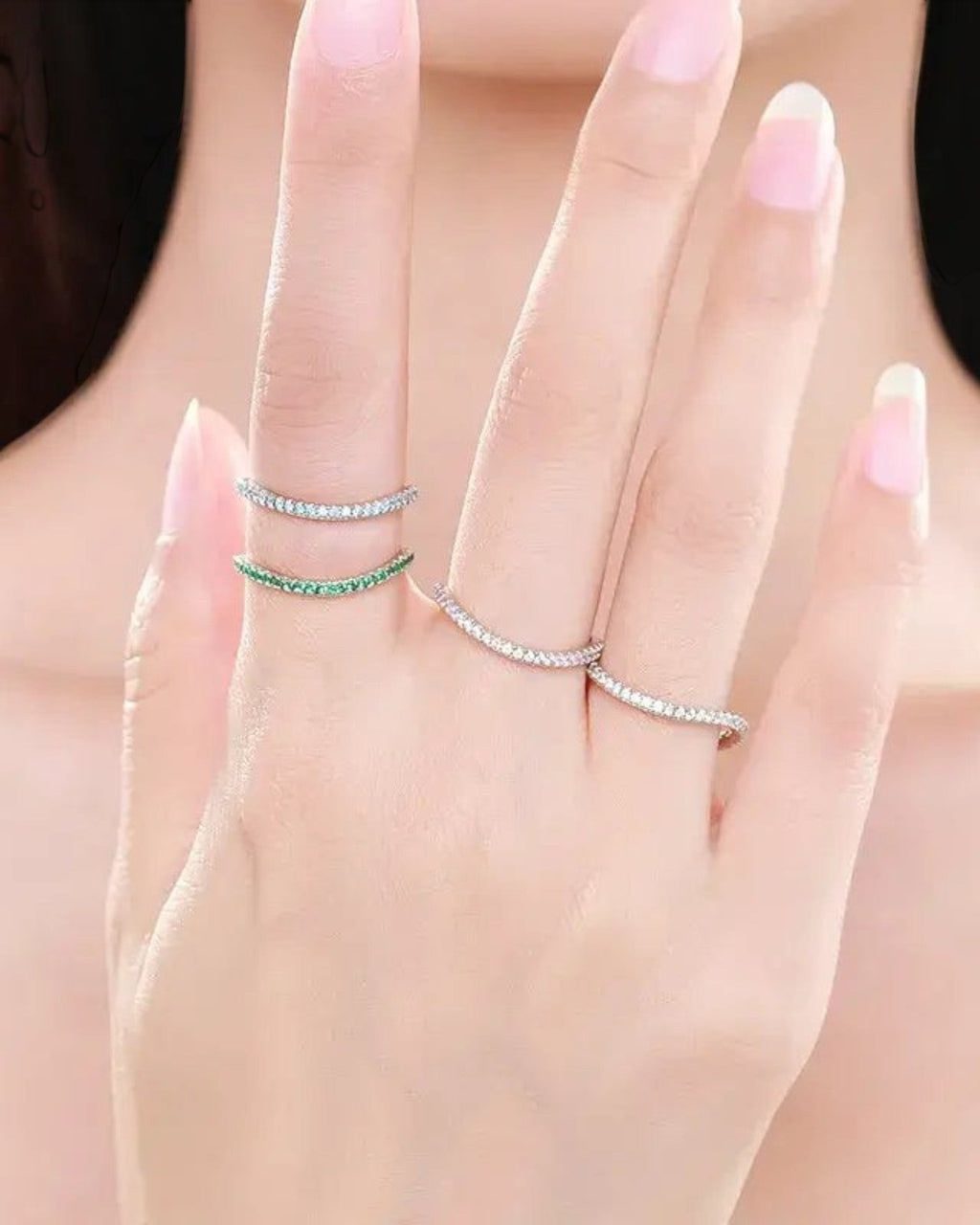 Pearlystones Azure Glow sterling silver eternity bands with blue and green zircon stones worn stacked on fingers