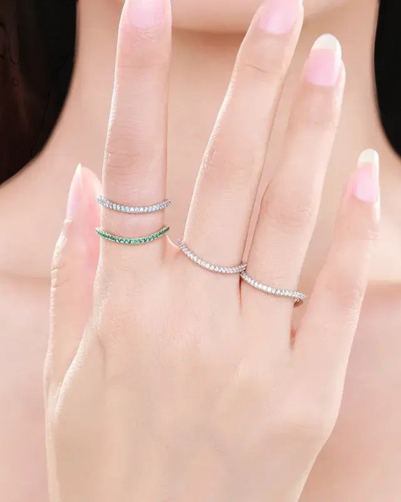 Pearlystones Azure Glow sterling silver eternity bands with blue and green zircon stones worn stacked on fingers
