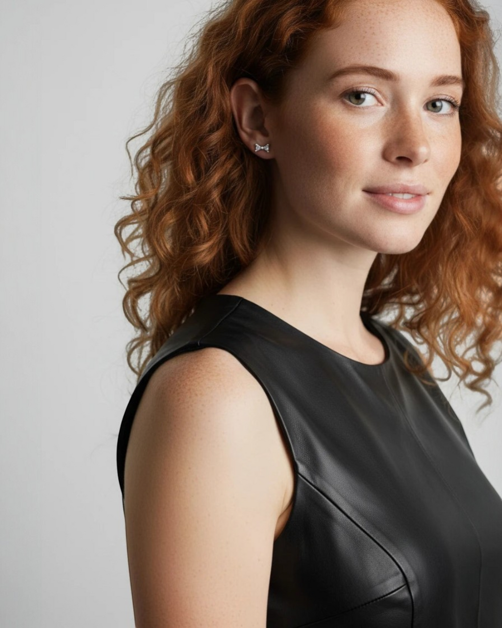 Pearlystones small sterling silver bow stud earrings with white gold plating. Delicate and elegant.