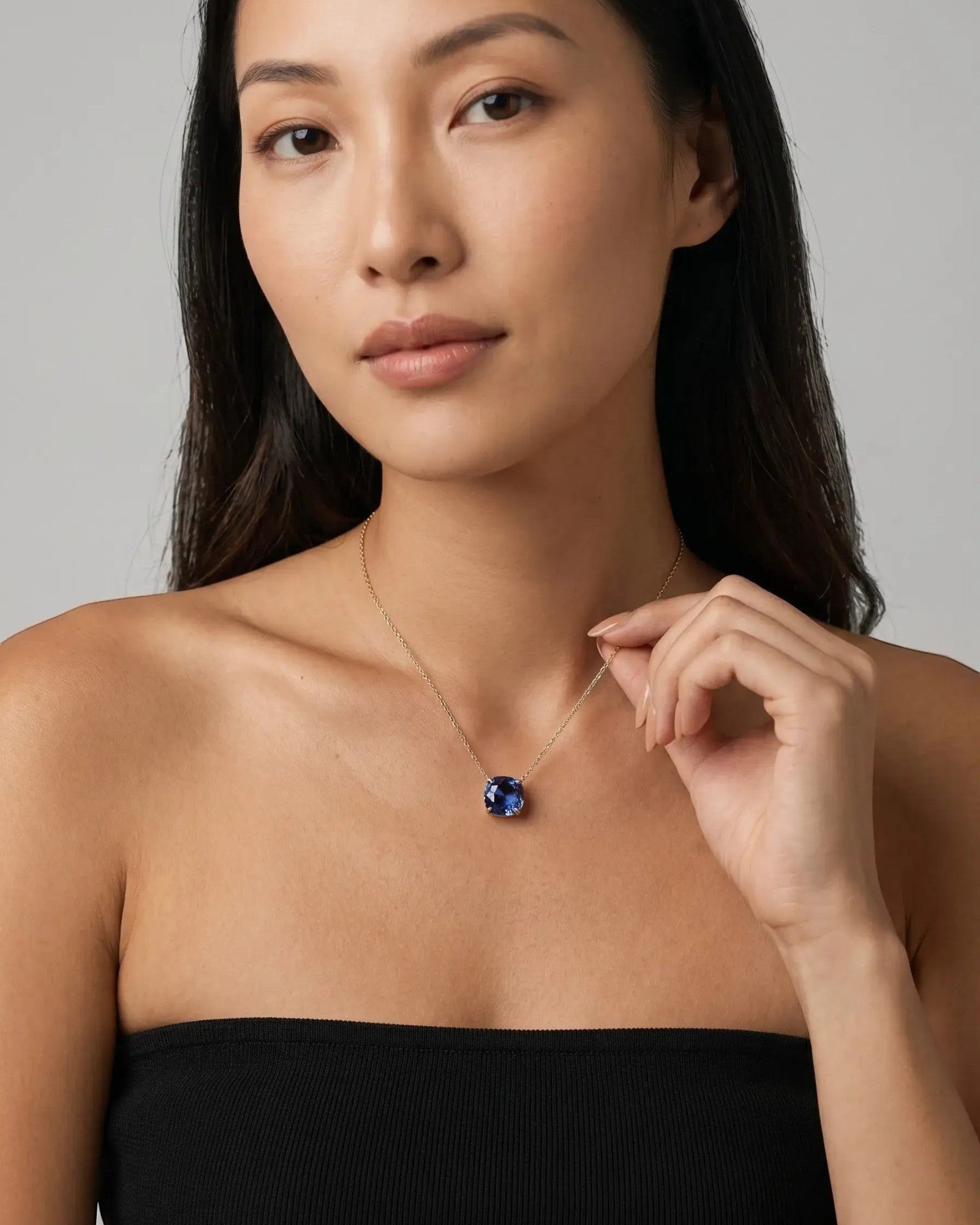Pearlystones tanzanite blue zircon pendant necklace in silver, featuring an octagonal rose cut stone on an adjustable chain.