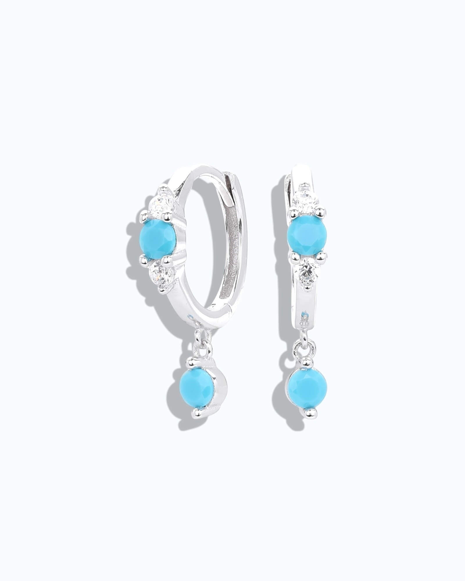 Pearlystones sterling silver hoop earrings with dangling turquoise  coloured stones and cubic zirconia accents.