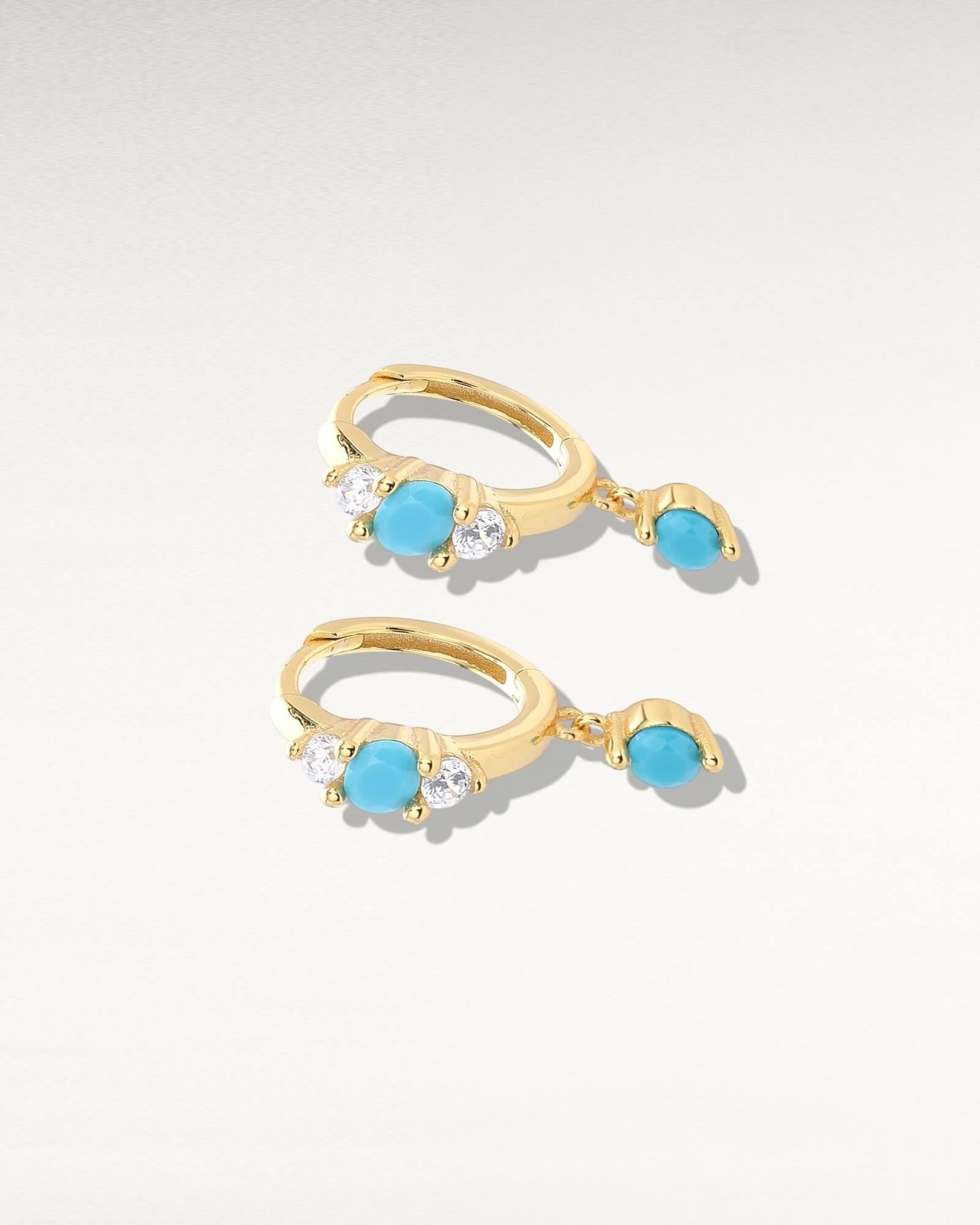 Pearlystones gold hoop earrings with turquoise drop and cubic zirconia accents.