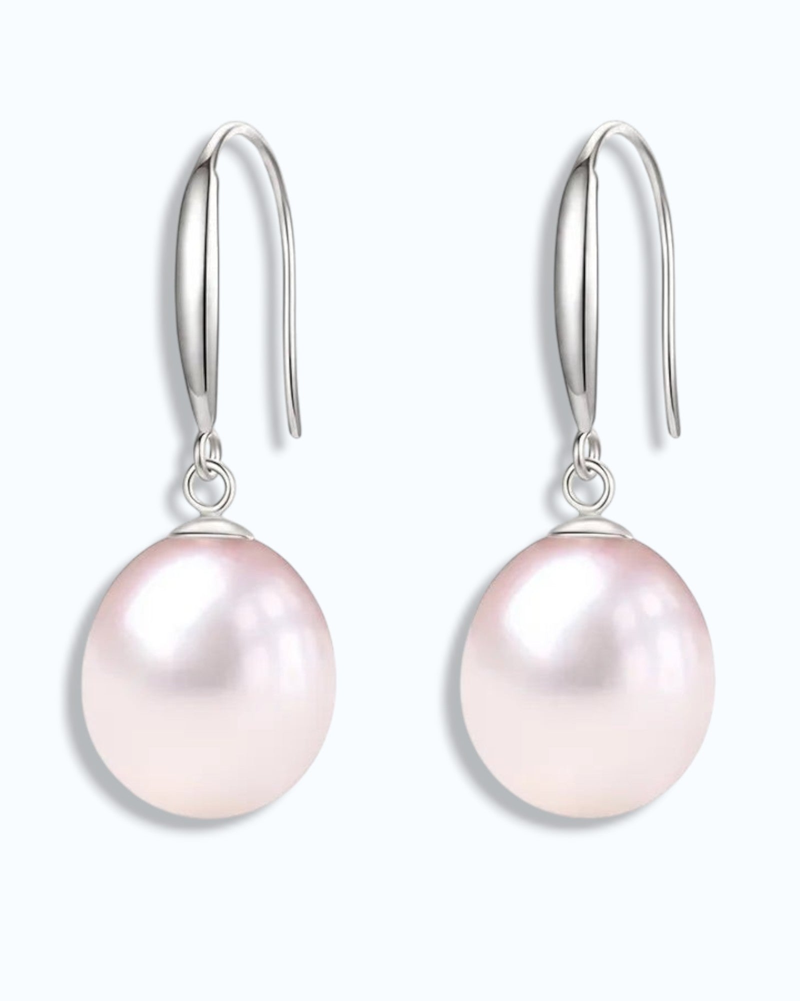 Pearlystones classic white pearl drop earrings in sterling silver with gold plating.