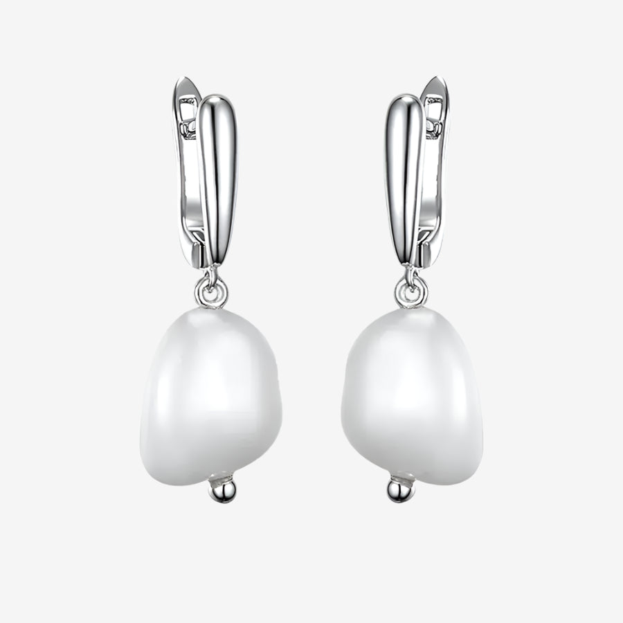 Lumera Pearl Hoops in 925 sterling silver with white gold plating and elegant pearls, a timeless accessory for any outfit.