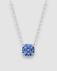 Octagonal Rose Cut Tanzanite Blue Zircon Pendant Necklace in Silver with a sparkling blue stone on a silver chain.