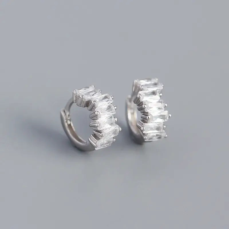 Sparkly sterling silver hoops with clear cubic zirconia stones, comfortable 8mm diameter earrings, elegant accessory.