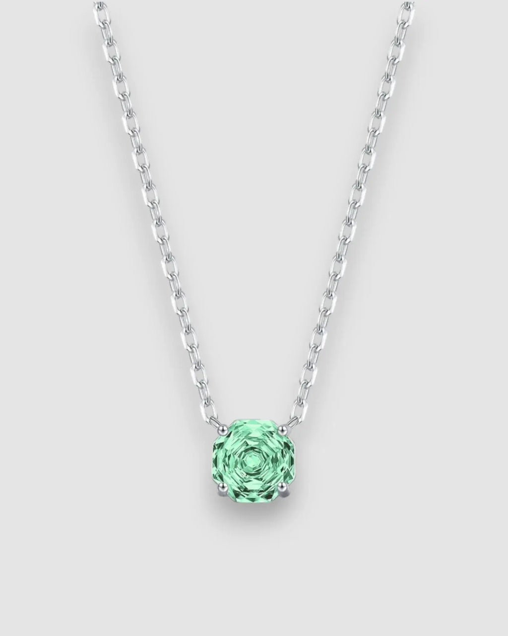 Octagonal rose cut green zircon pendant necklace in silver, showcasing a stunning light-catching stone.