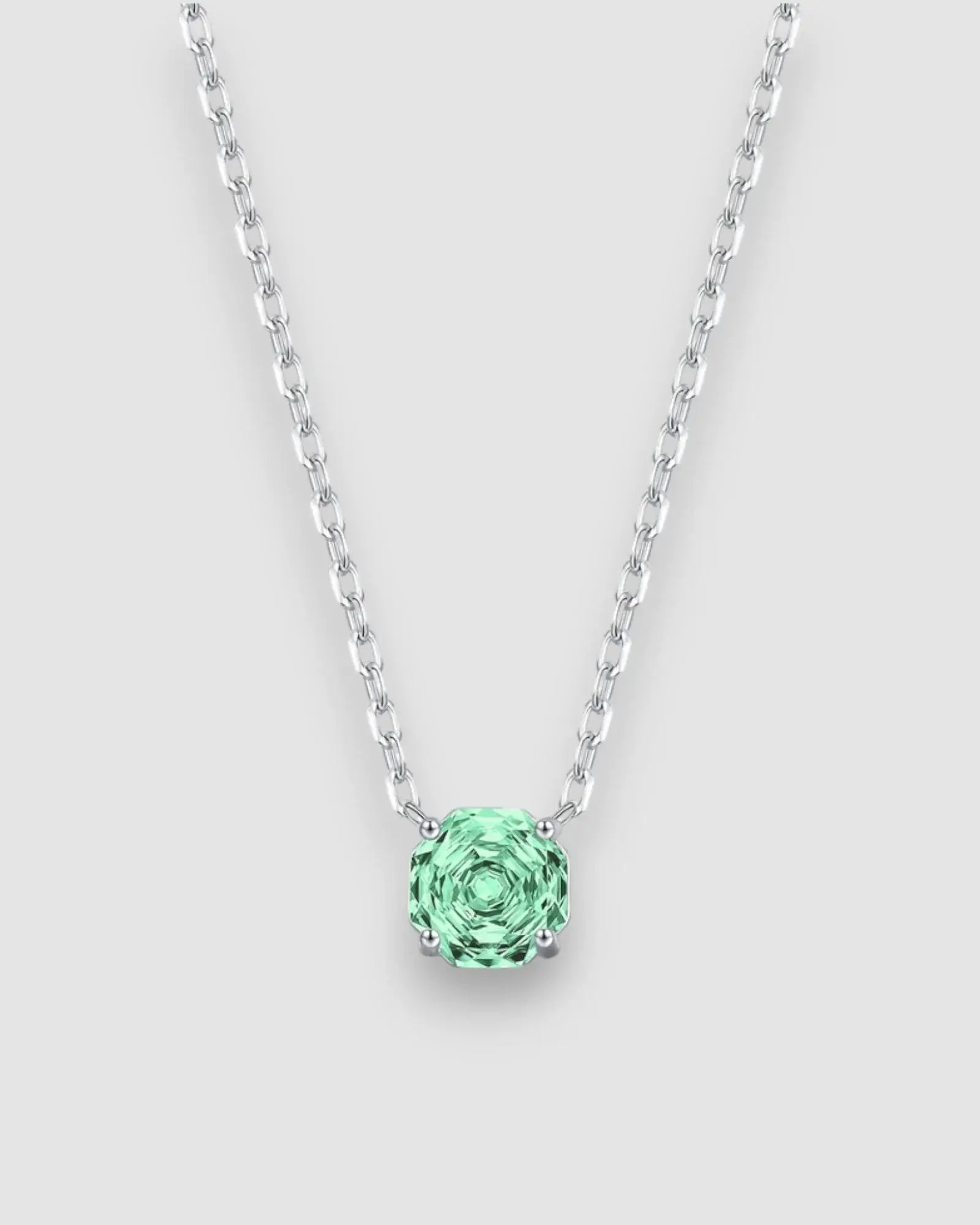 Octagonal rose cut green zircon pendant necklace in silver, showcasing a stunning light-catching stone.