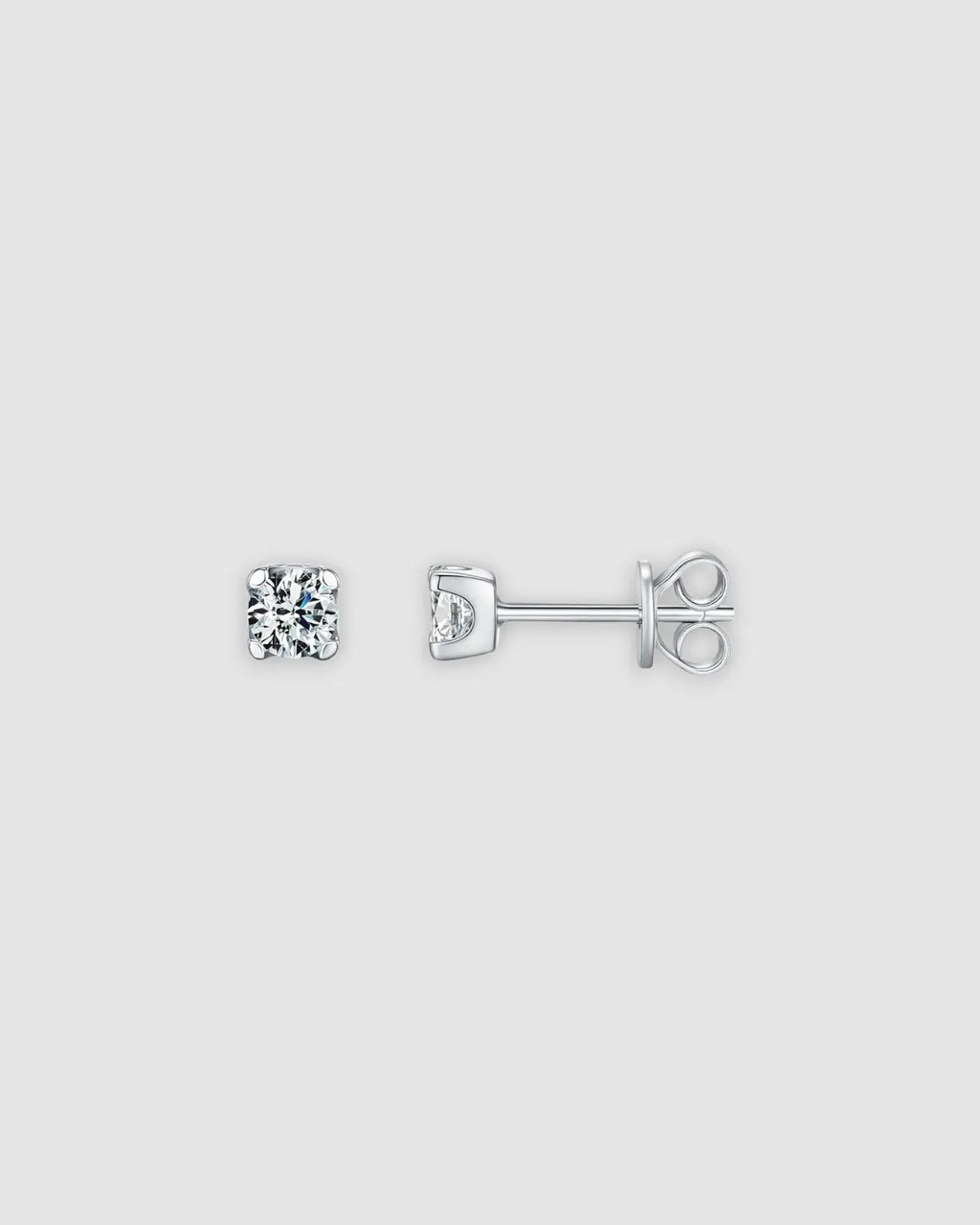 4mm Round brilliant cut moissanite studs in sterling silver with rhodium finish, showcasing classic prong setting.