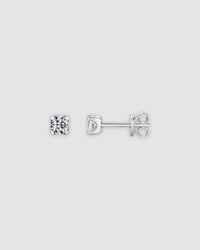 4mm Round brilliant cut moissanite studs in sterling silver with rhodium finish, showcasing classic prong setting.