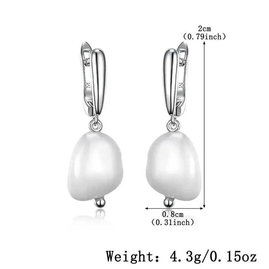 Lumera Pearl Hoops in 925 sterling silver with white gold plating, featuring an elegant pearl drop accessory.