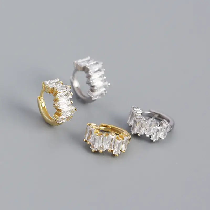 Sparkly sleeper hoops in sterling silver and 18k gold plating, featuring a dazzling cluster design.