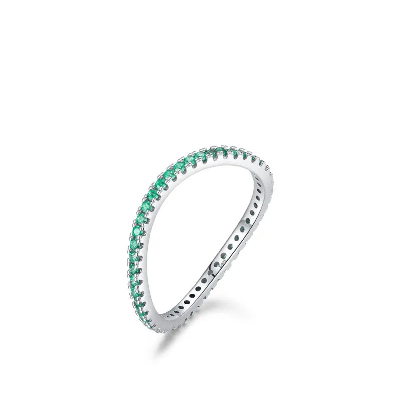 Emerald Glow Eternity Band in sterling silver with vibrant green zircon stones, elegant design for stacking or solo wear.