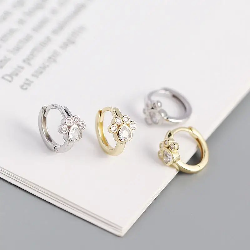 Cat Footprint Hoops in sterling silver, yellow gold, and white gold with paw design, perfect for everyday elegance.