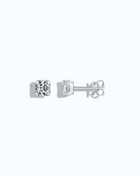 5mm Round brilliant cut moissanite studs displayed on a light gray background.