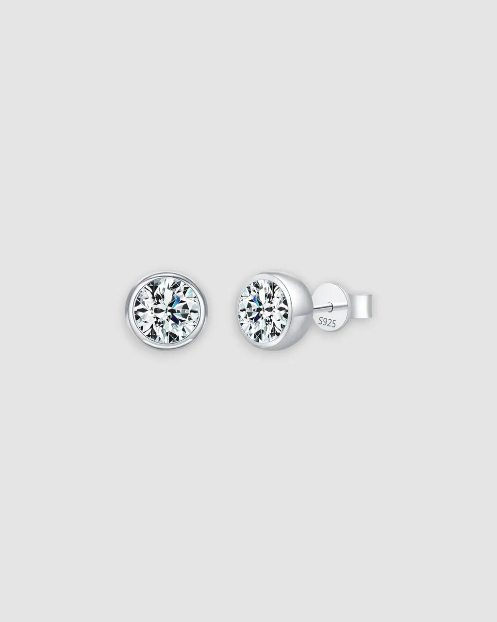 2Ct Round Bubble Moissanite studs in sterling silver with a rhodium finish, featuring a modern bezel setting.